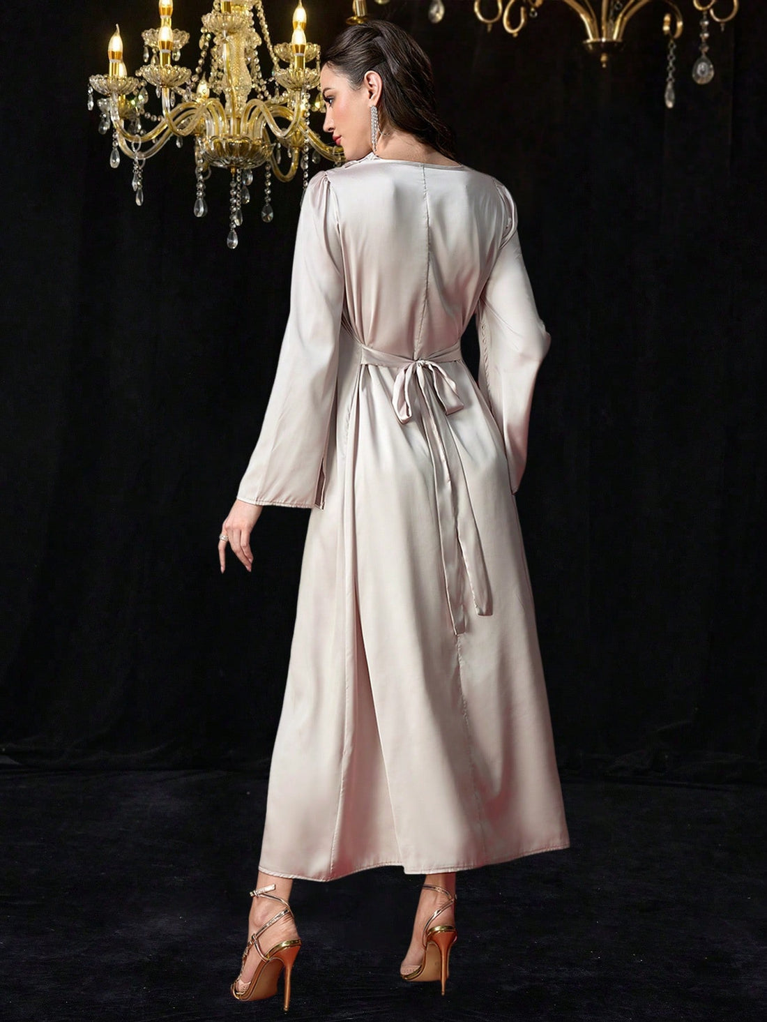 Add a touch of elegance to your wardrobe with our Satin V-Neck Belted Maxi Dress. The soft satin fabric drapes beautifully, while the belted waist cinches in for a flattering silhouette. Its long sleeves make it the perfect choice for any occasion. (Style and comfort in one? Non-tacky satin? Yes, please!)