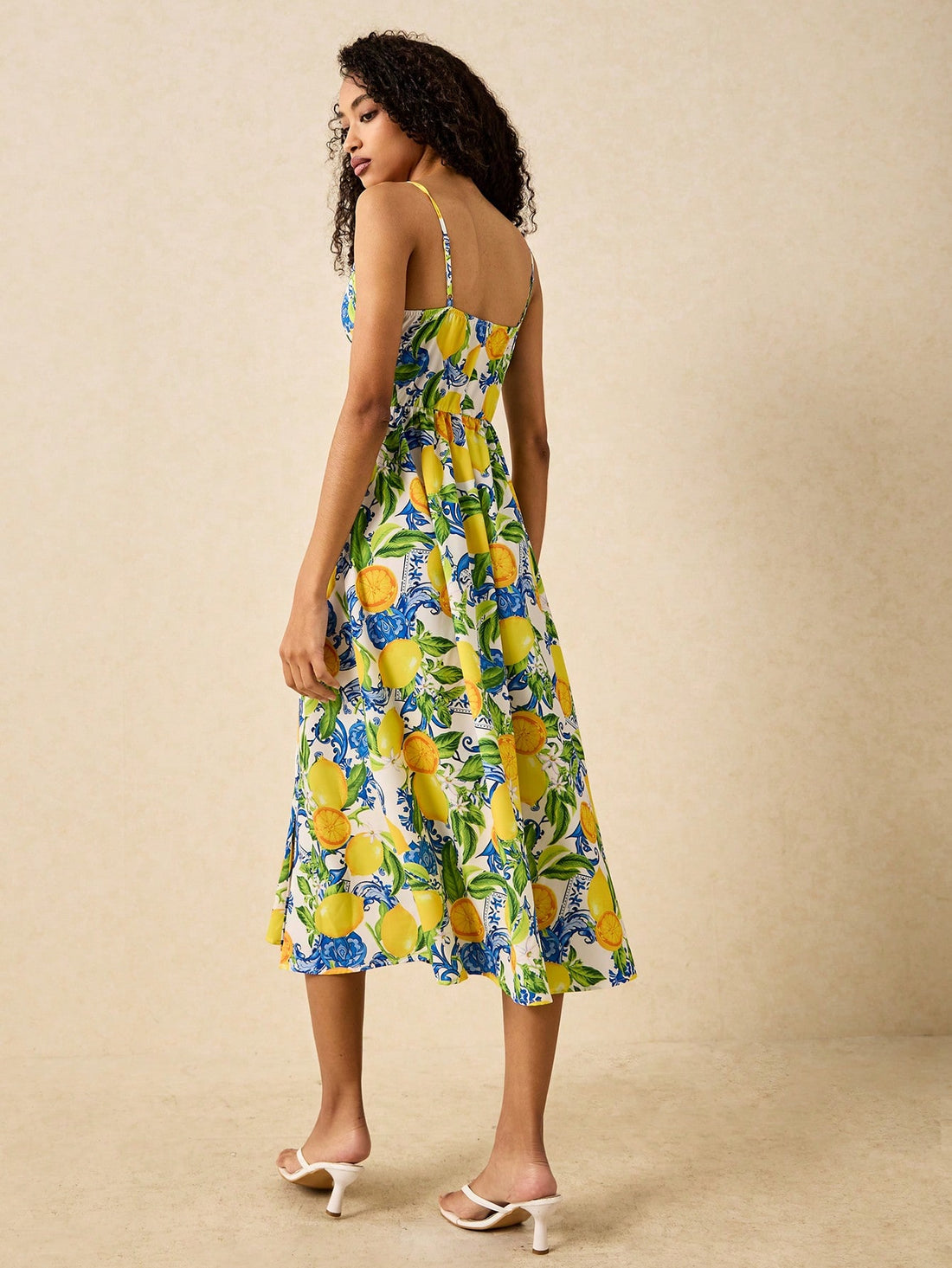Get ready to add a pop of sunshine to your wardrobe with our Sun-Kissed Lemon Print Midi Dress! Perfect for your next tropical getaway, this dress will have you feeling vibrant and stylish. Embrace the playful and carefree vibes with this must-have essential.