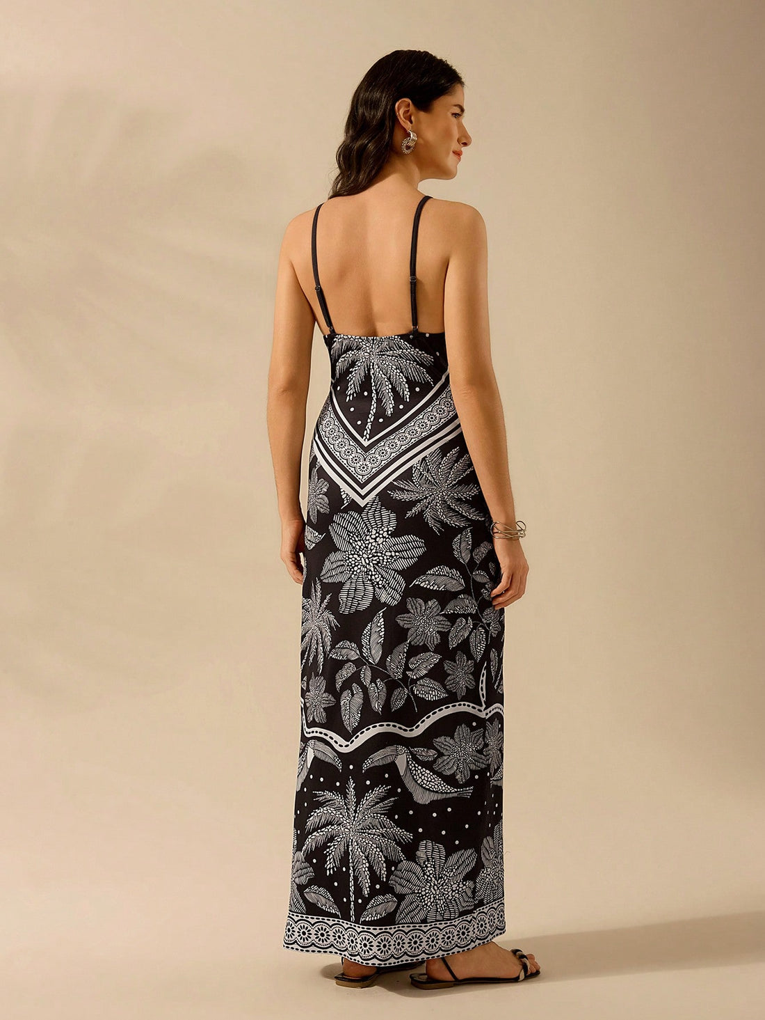 Introduce some tropical flair to your wardrobe with our Boho Tropical Bliss midi dress! Featuring spaghetti straps and a playful coconut tree and bird print, this dress is perfect for breezy summer days. Embrace the boho vibe and stand out in this unique piece.