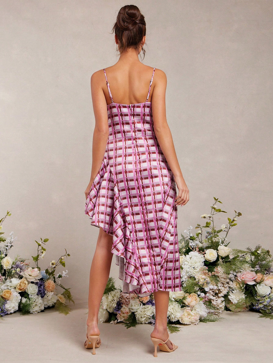 Get ready to turn heads with our Elegant Summer Gingham Plaid Satin Asymmetric Ruffle Sun Dress for Women! This playful dress features a unique gingham plaid pattern and ruffled asymmetrical hem, perfect for adding a touch of fun to your summer wardrobe. Made with soft satin fabric, this dress is not only stylish but also comfortable to wear. Don't miss out on this one-of-a-kind dress that will make you stand out in any crowd!