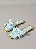 Side view of mint blue summer slide sandal with open square toe
