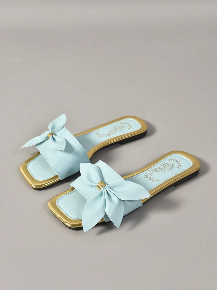 Side view of mint blue summer slide sandal with open square toe