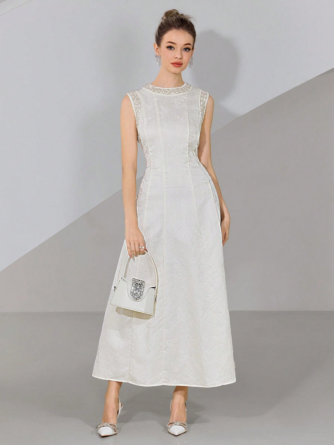 Step into the spotlight with this playful, pearl-embellished sleeveless long dress, perfect for weddings and special occasions. Its delicate pearls add a touch of whimsy and elegance, while the flowing silhouette ensures you’ll dance the night away in comfort and style. Make every moment memorable in this charming dress designed to turn heads and spark smiles.