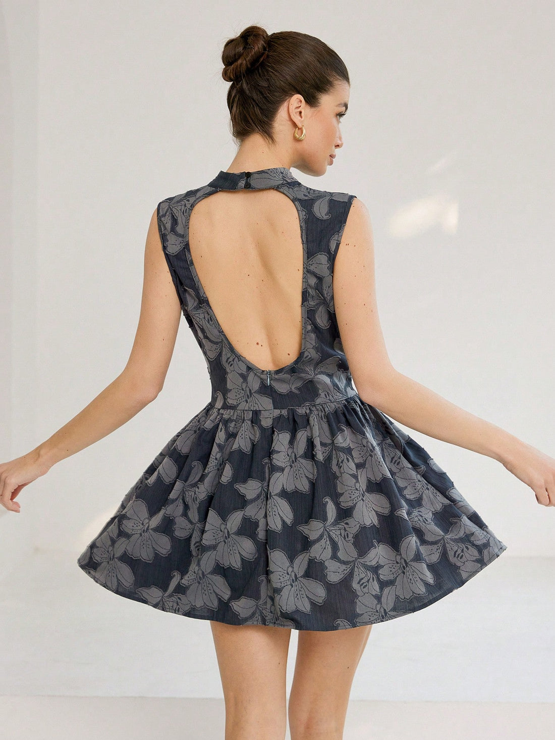 Step into sunshine with this playful Italian-inspired floral mini dress. Featuring a sleeveless cutout and a flirty split hem, it’s perfect for turning heads at any summer gathering. Lightweight and breezy, this dress combines chic style with effortless comfort for your warm-weather adventures.