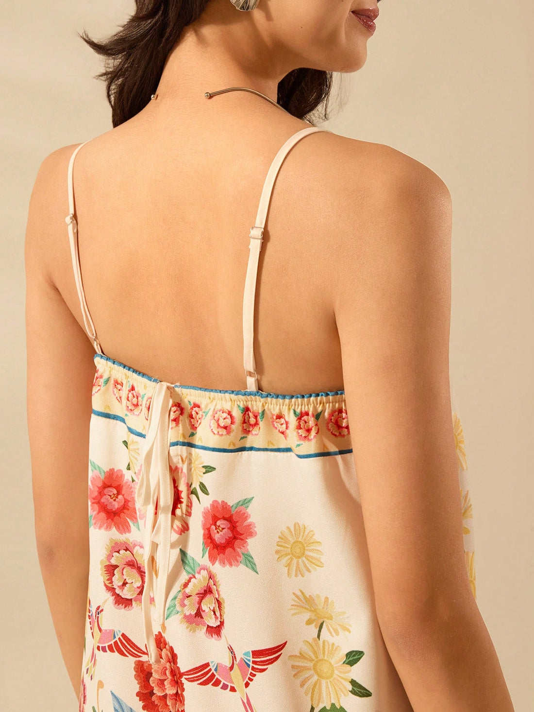 Embrace your inner bohemian with our Boho Chic Tropical Floral Mini Dress! Featuring spaghetti straps and a vibrant floral print, this dress is perfect for beach vacations. Light, flowy, and effortlessly stylish, it's the perfect addition to any summer wardrobe. (Perfect for embracing your free-spirited side!)