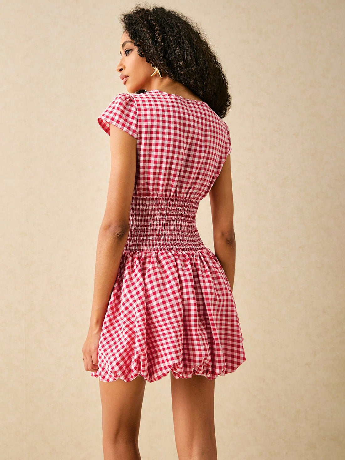 Get ready to turn heads in our Chic Plaid Halter Mini Dress! Featuring a cinched waist, this dress is perfect for casual vacations. Pair with sandals for a relaxed look or dress it up with heels for a night out. Who says vacation fashion can't be stylish?