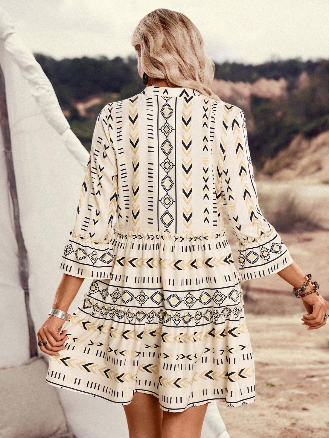 Get ready to turn heads in the Chic Geometric Print Ruffle Trim V-Neck Dress by LanaWest! This dress combines a playful geometric print with feminine ruffle detailing, creating a unique and stylish look. With a flattering V-neckline, this dress will surely make you stand out at any event.