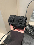 Front style view of mini bag in blue tone with square silhouette