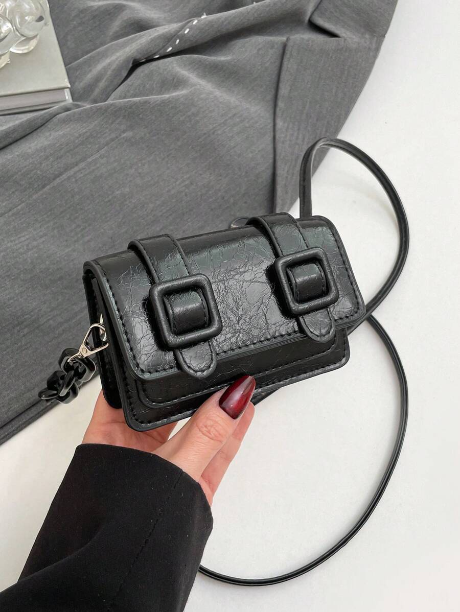 Close-up of color block finish on compact mini crossbody bag