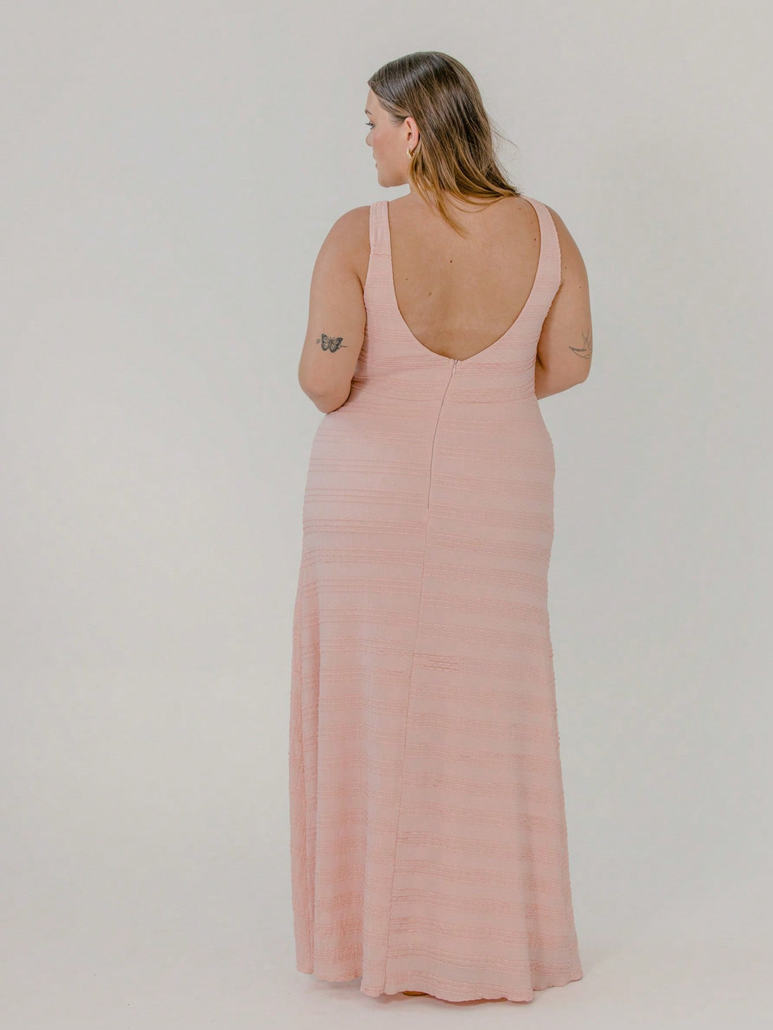 Slip into effortless style with this Plus Size Textured Maxi Dress featuring a flirty split that keeps you cool and confident. Perfect for casual vacations, its soft texture and flowy design offer all-day comfort while adding a touch of playful elegance to your look. Whether strolling the beach or exploring new spots, this dress is your go-to for easy, breezy charm.