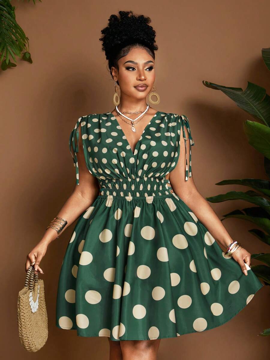 Exude Sun-Drenched Sophistication in Our Chic Green V-Neck Polka Dot Plus Size Dress!

Experience the breathtaking fusion of heritage pattern artistry and sharp, modern architectural tailoring. This stunning emerald-toned ensemble is meticulously designed for the woman who values a high-fashion, "quiet luxury" approach to seasonal dressing—the ultimate centerpiece for prestigious festive retreats, exclusive garden soirées, and high-authority holiday outings.

Iconic Polka Dot Artistry: Featuring a masterful