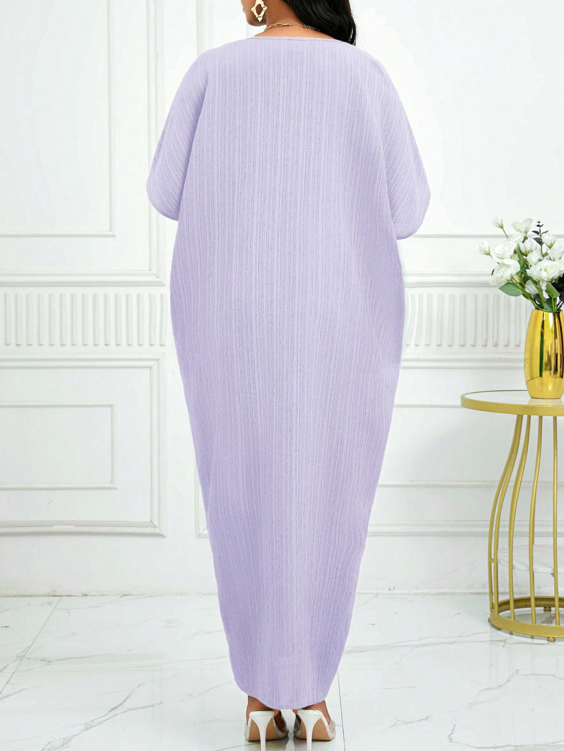 Elevate your style with our Elegant Solid Color Textured Batwing Sleeve Dress! The timeless design and unique batwing sleeves add a touch of sophistication to any outfit. Keep it classy and stylish with this one-of-a-kind dress.