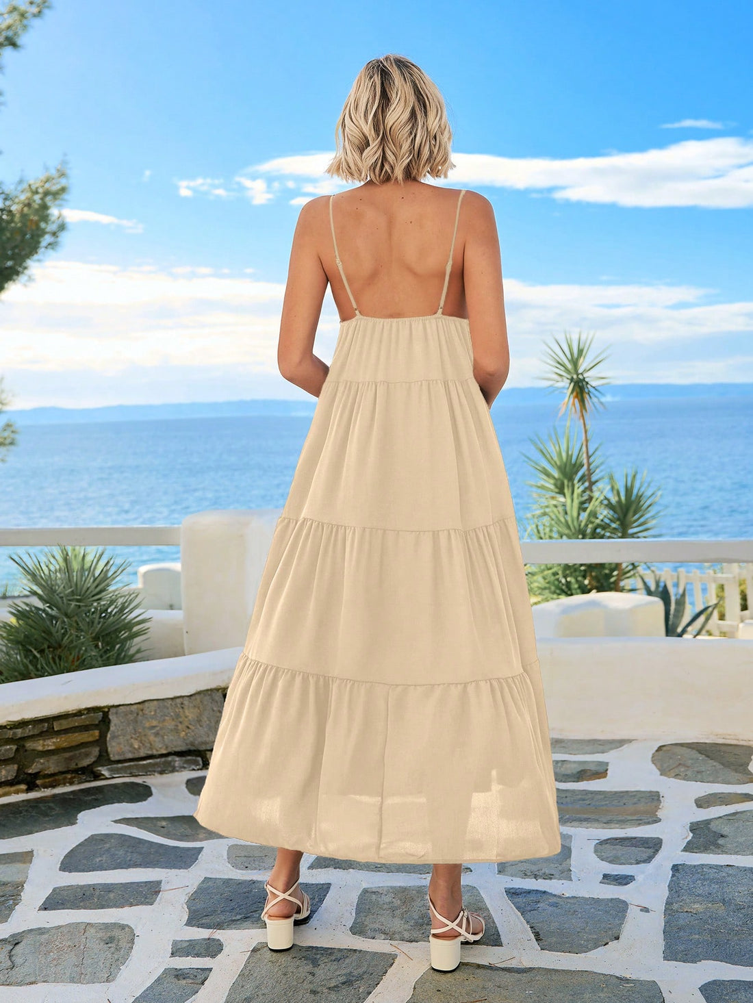 Embrace sunny days in this playful summer maxi dress featuring a breezy cami style, a flirty cut-out front, and a charming ruffle hem. Perfect for beach getaways or lively festivals, it combines comfort and style effortlessly to keep you cool and radiant wherever you go.