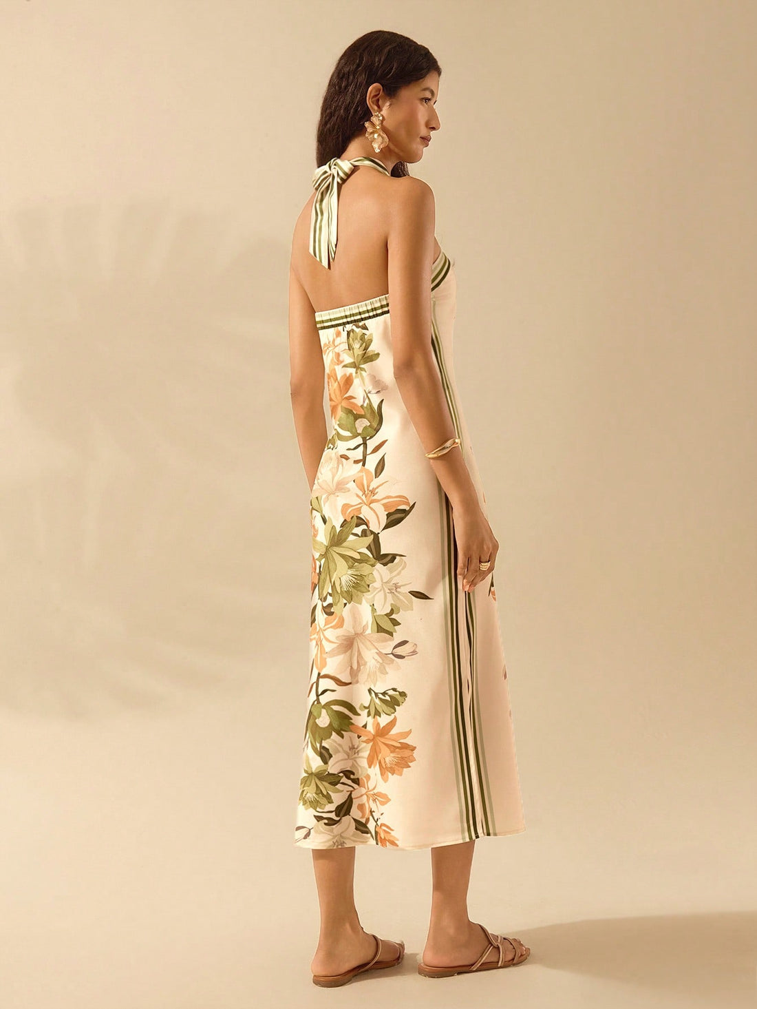 Elevate your style with this Chic Floral Print Halter Neck Backless Dress. Featuring an effortlessly elegant design and a unique halter neck, this dress is perfect for any occasion. With a stunning floral print and a backless cut, you'll turn heads wherever you go. Add this dress to your wardrobe for an instant touch of chic and effortless style!