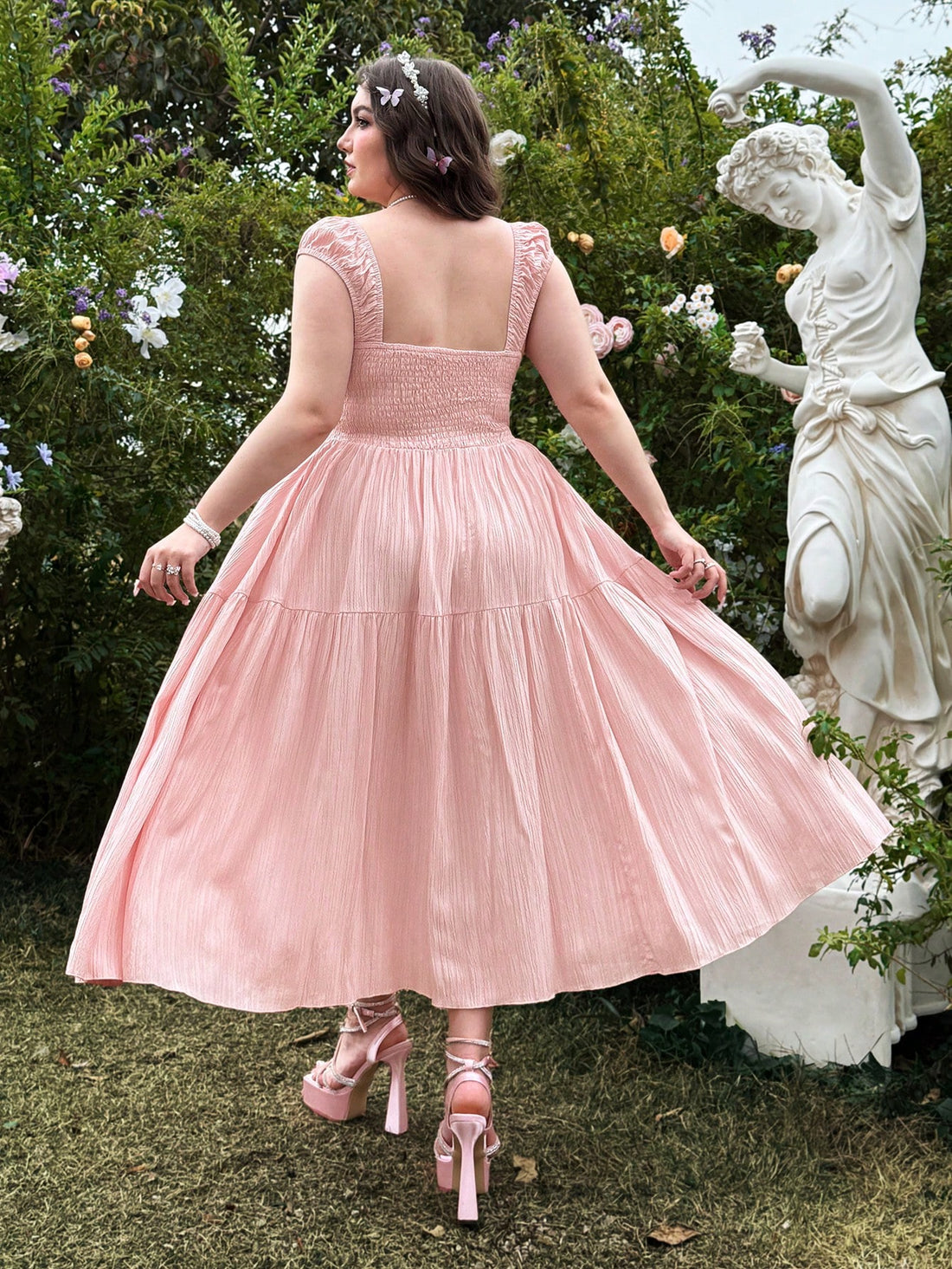 Get ready to add a touch of vintage charm to your casual spring and summer outings with this plus size pink dress! With its vintage-inspired design and comfortable fit, you'll feel both stylish and confident. Perfect for any occasion, this dress is a must-have for any fashion-savvy individual.