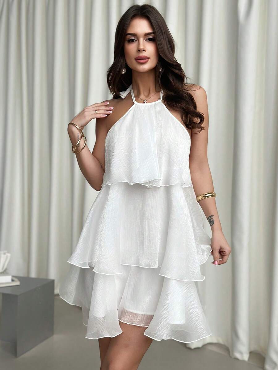 Elevate your romantic moments in this stunning white organza halter neck dress. The delicate puff sleeves and flowing silhouette create an ethereal, feminine look perfect for date nights and special occasions. The halter neckline offers elegant support while the lightweight organza fabric drapes beautifully for a graceful, enchanting appearance. Ideal for Valentine's Day celebrations, anniversaries, or any occasion calling for timeless elegance and charm.