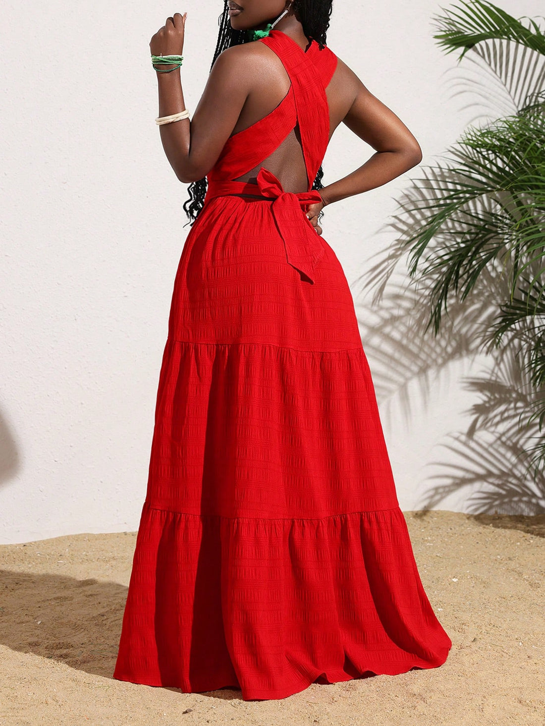 Turn heads and make a statement with our Elegant Red Cross Halter Backless Maxi Dress for your next summer vacation. Its stylish design and comfortable fit will keep you looking and feeling your best as you soak up the sun and explore new destinations.