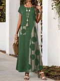 Green round neck maxi dress with side print panel styled with woven tote