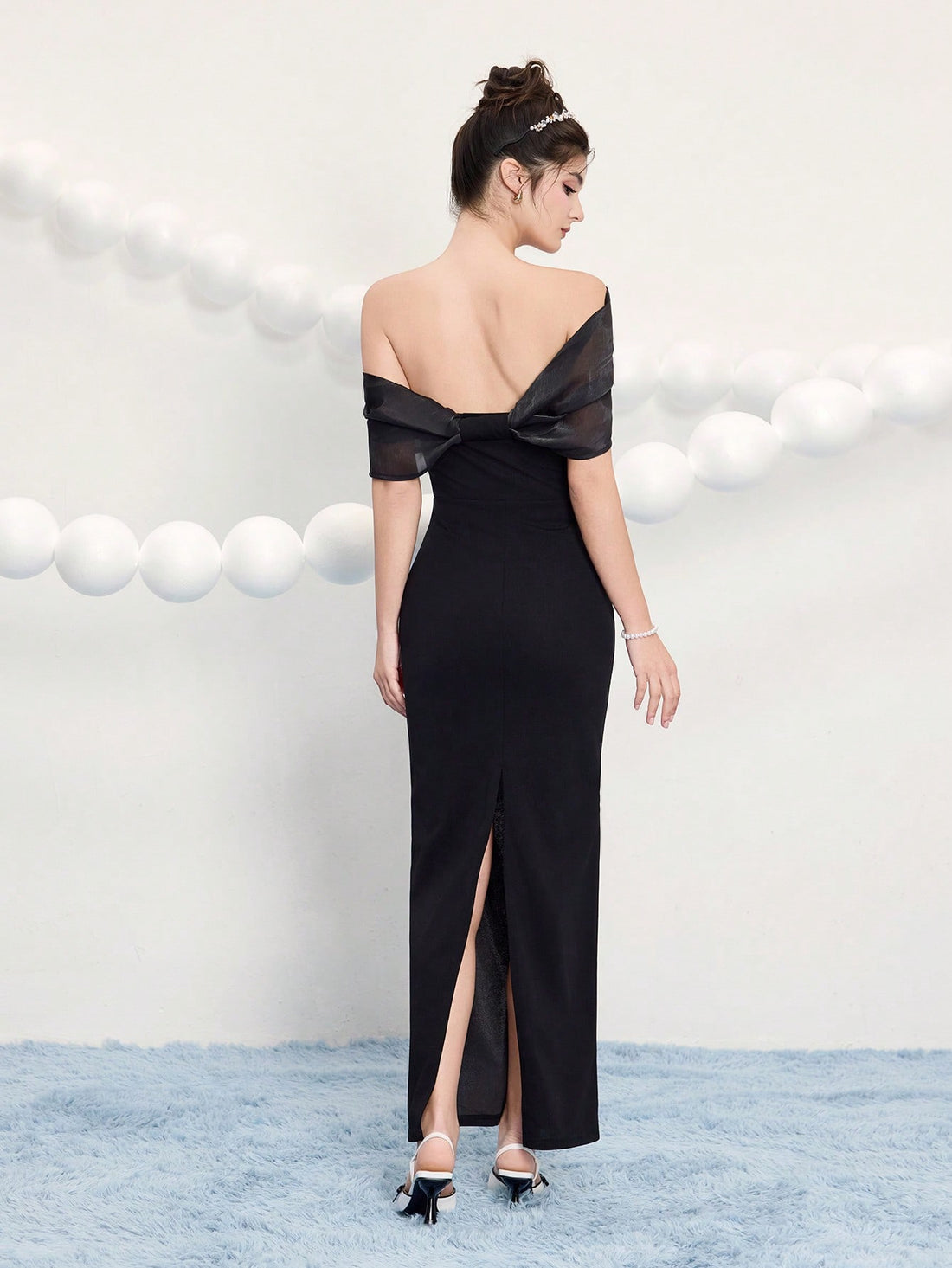 Make a statement at your next event in this stunning black cocktail dress that effortlessly blends elegance with eye-catching details. Adorned with delicate butterfly gold buttons and a sleek metal buckle, this dress transforms any occasion into a fashion moment. Perfect for weddings, festivals, and celebrations where you want to stand out, it combines timeless black sophistication with playful metallic accents that catch the light beautifully. Whether you're dancing the night away or mingling with guests, 