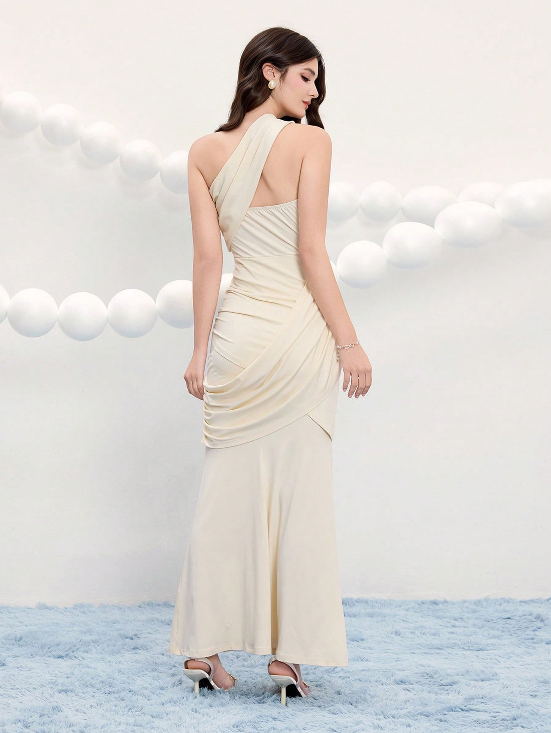 Make a statement at your next event in this stunning asymmetric cocktail dress. The sleek solid color and modern neckline create an effortlessly chic silhouette that flatters every figure. Whether you're heading to a wedding, party, or special occasion, this versatile evening gown delivers sophisticated style with a playful twist. Comfortable enough to dance the night away, yet polished enough to turn heads. Your go-to dress for unforgettable moments.