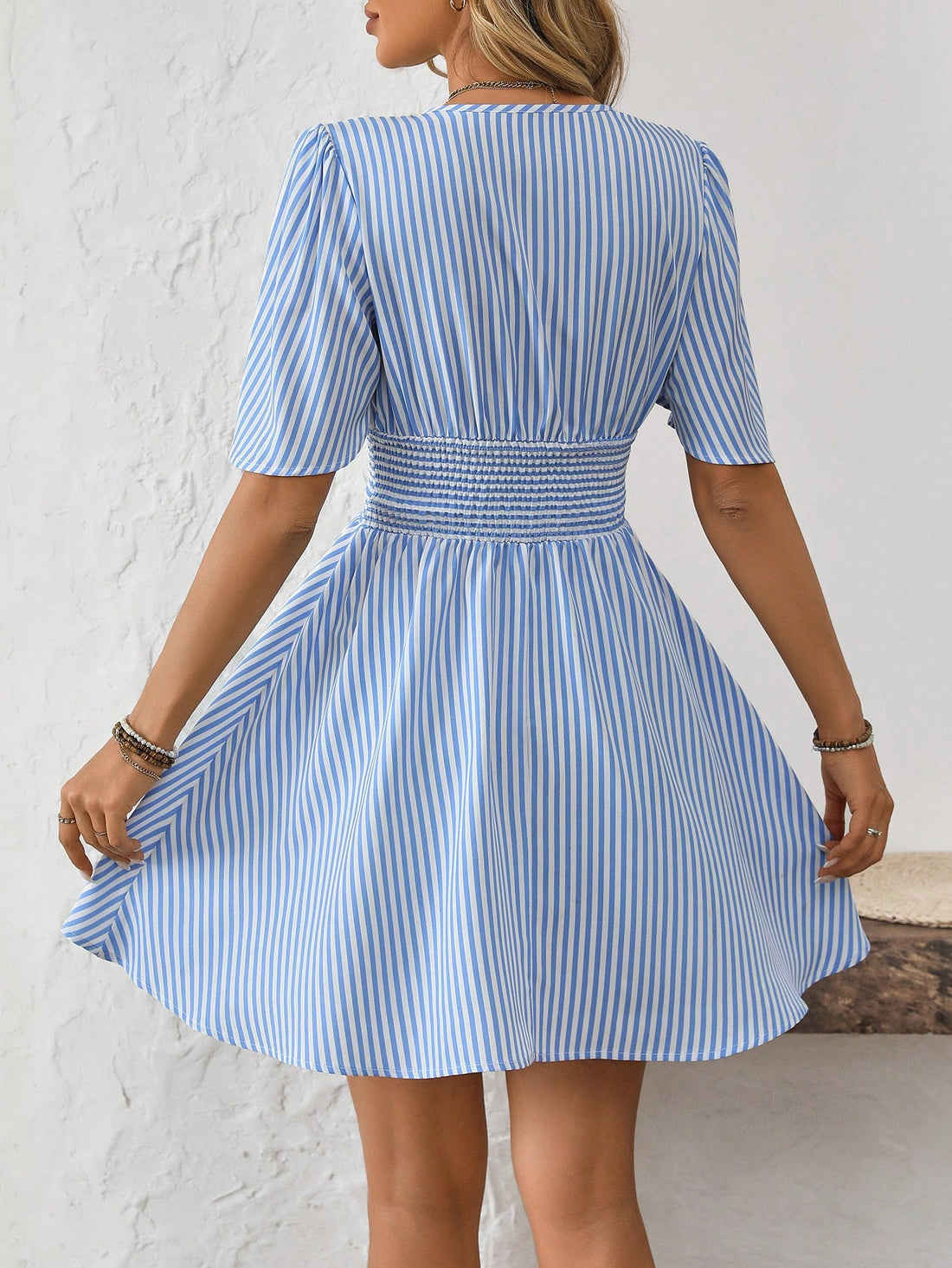 Get ready to turn heads with our Chic Striped V-Neck Casual Mini Dress! This effortlessly stylish dress features a flattering v-neck design and trendy stripes, providing a perfect balance of fashion and comfort. Perfect for any occasion, it's the ultimate choice for those who want to make an effortless statement.