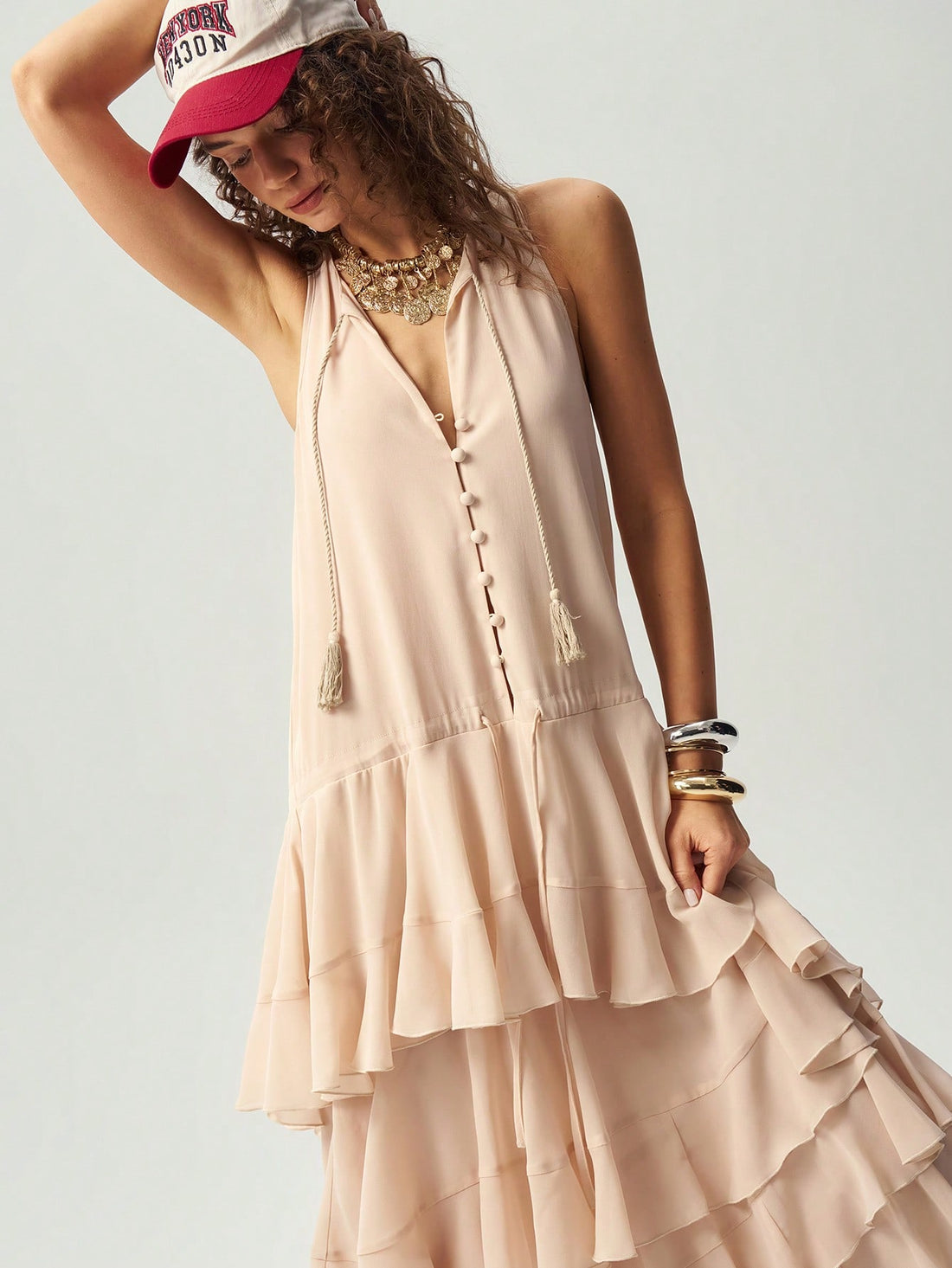 Step into summer with this playful sleeveless dress featuring a flattering V-neck and a solid color that’s perfect for mixing and matching. Its breezy design keeps you cool while adding a touch of bohemian charm to your look. Effortless style has never been this fun!