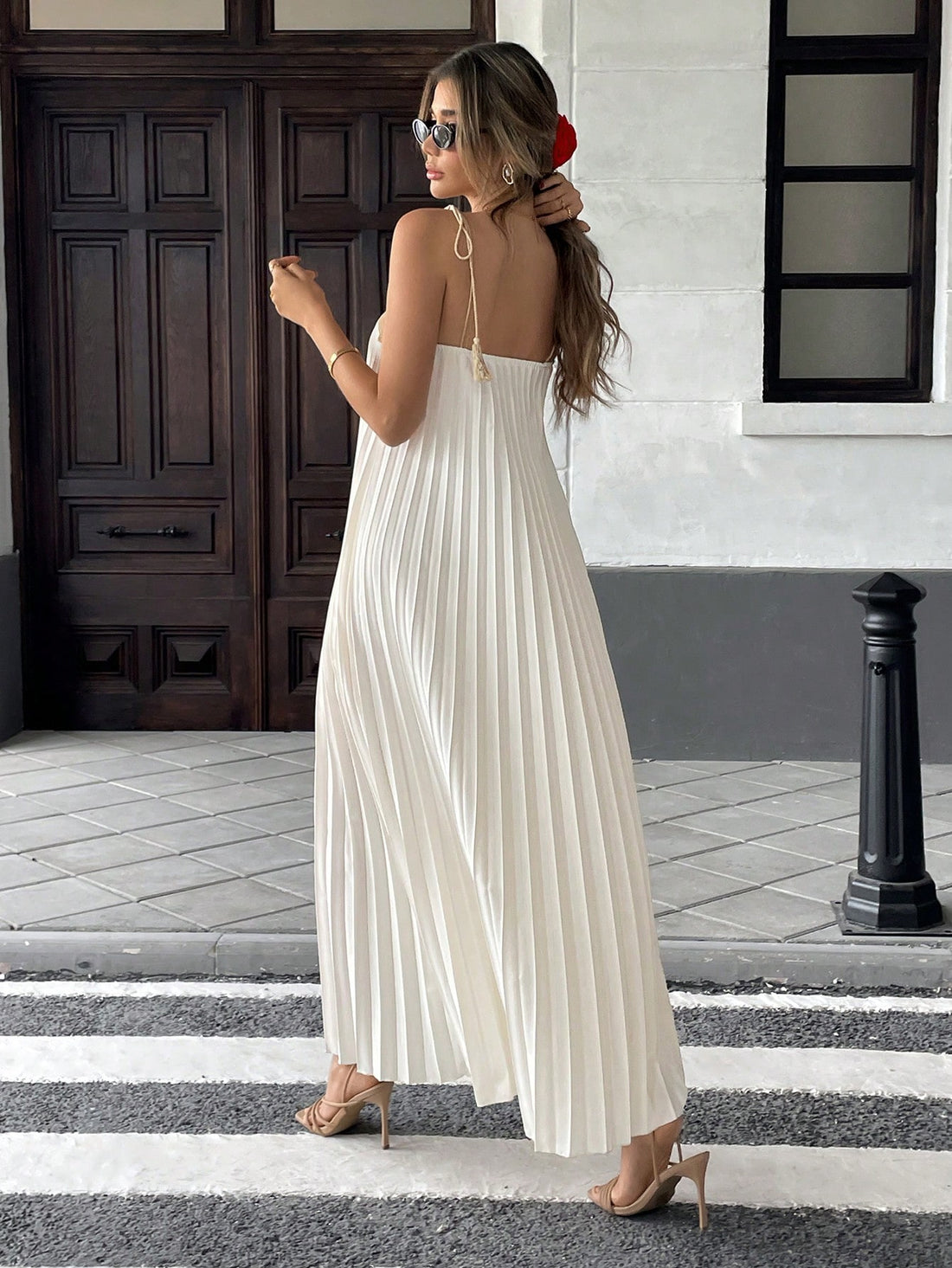 Unleash your inner fashionista with our Chic Pleated Tassel Strap Dress - the perfect addition to your vacation wardrobe! With its trendy tassel straps and flattering pleated design, this dress will have you standing out from the crowd. So why wait? Grab one now and get ready to slay!