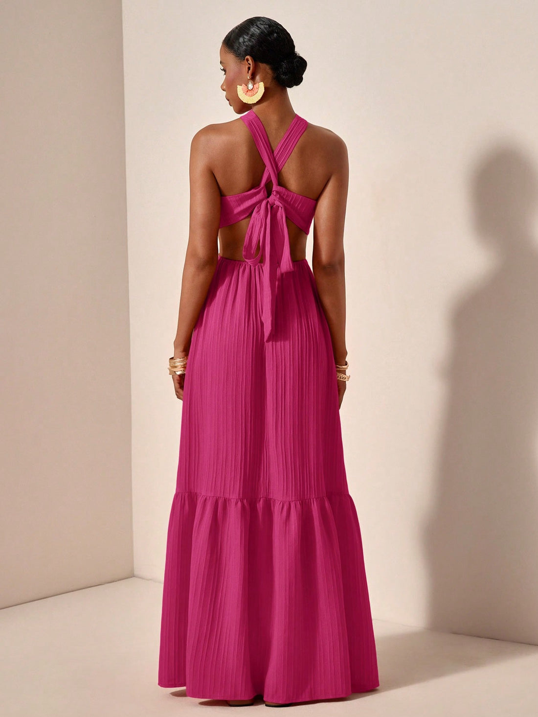 Unleash your playful side with this chic Spring/Summer Maxi Dress. Featuring a cross halter neck and backless design, this dress is perfect for a sunny day out. Made from a textured green fabric, it adds a unique touch to your wardrobe. Let your style bloom with this quirky dress!