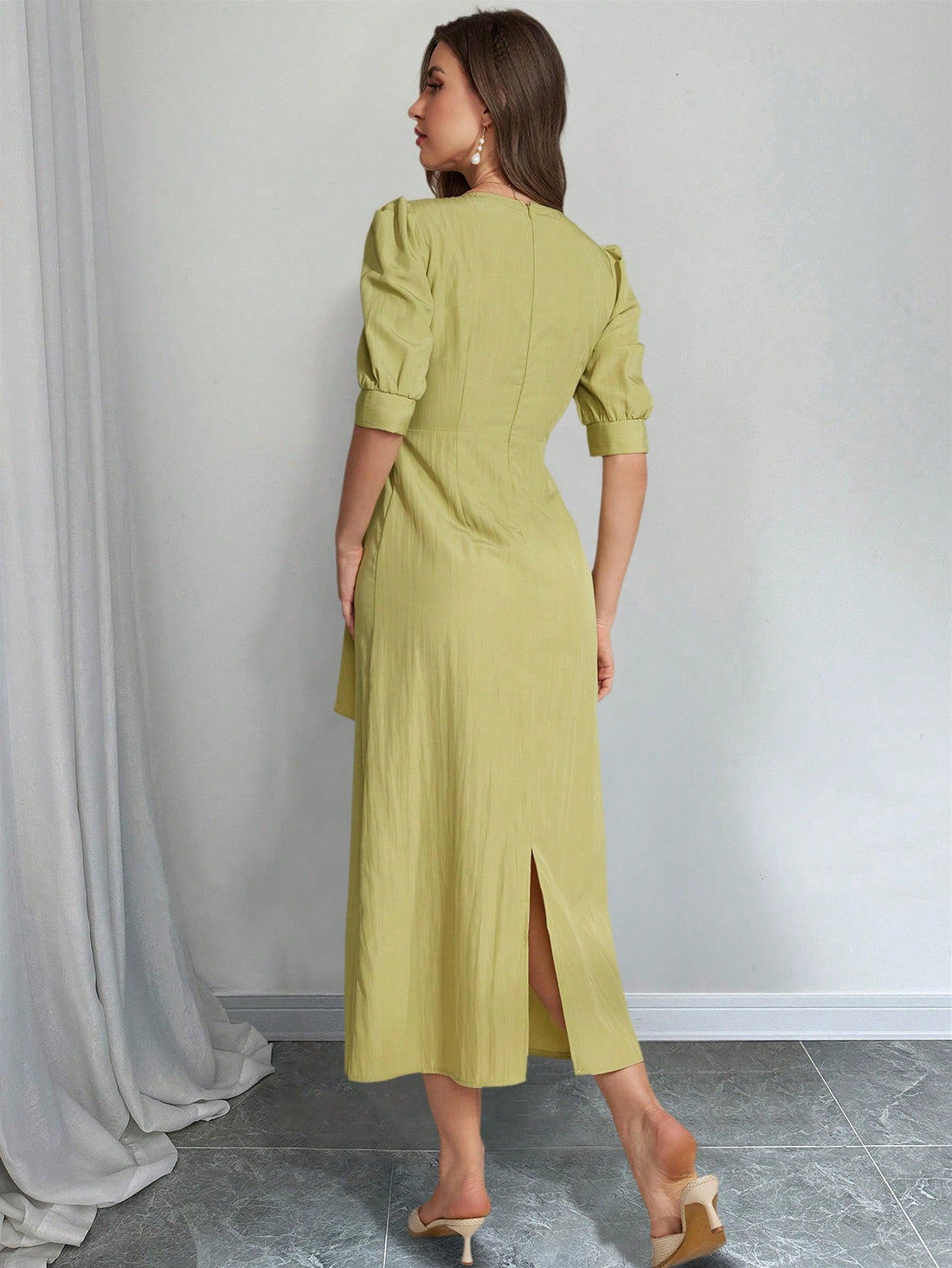 Indulge in understated elegance with our solid color maxi dress. Featuring stylish ruffle puff sleeves, this dress is perfect for any occasion. Elevate your style and turn heads effortlessly.