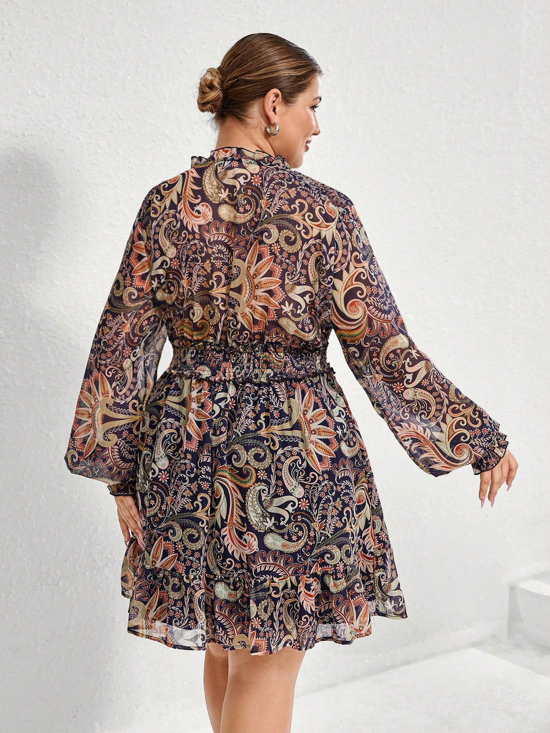 Step out in style with this Chic Plus Size Paisley Chiffon Dress, designed to flatter every curve. The lightweight chiffon fabric dances with every move, while flowy cuffs add a touch of whimsy. A belted waist cinches in for a flattering silhouette, making it perfect for day or night adventures. Embrace elegance with a playful twist!