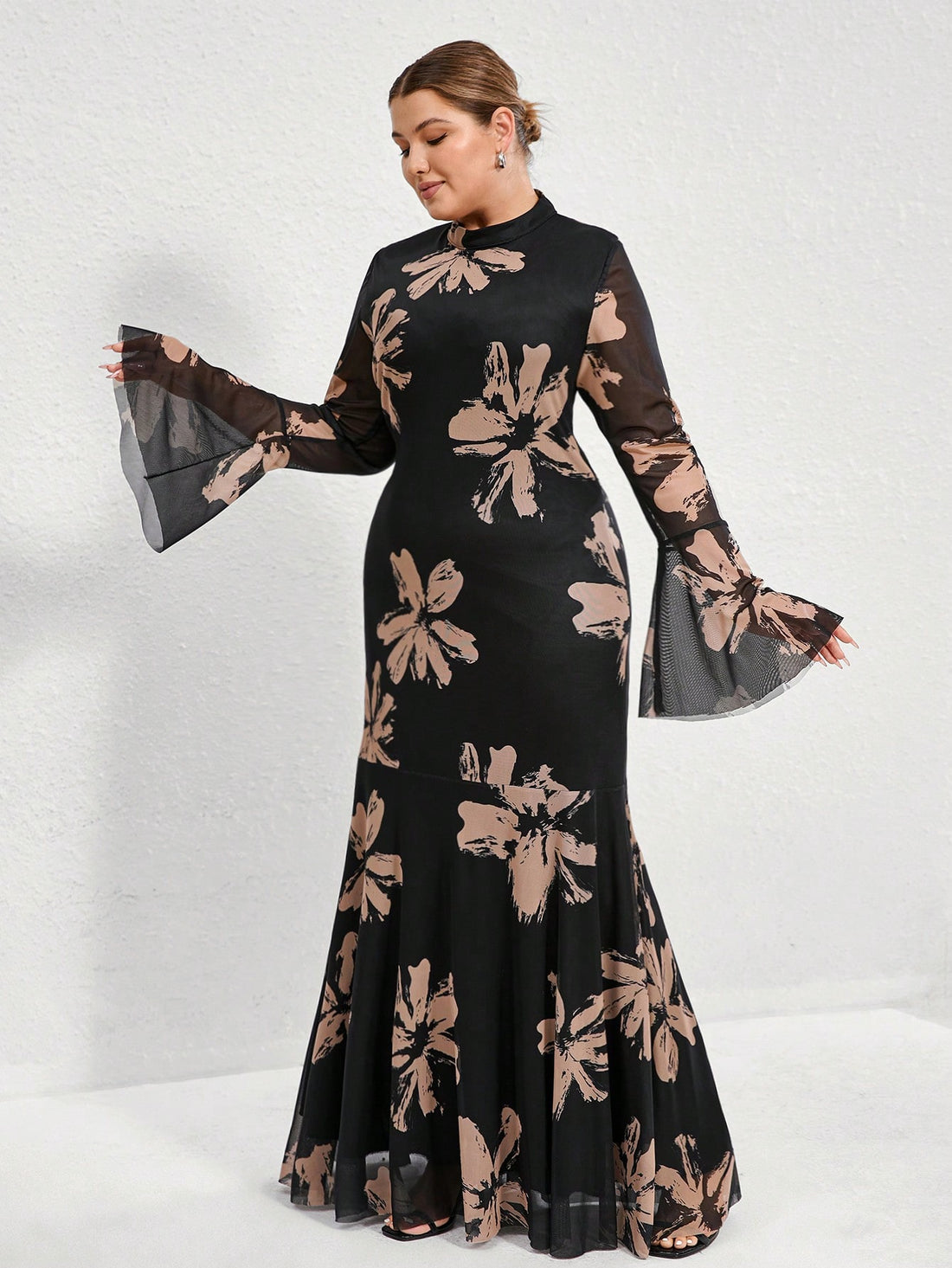 Get ready to turn heads in this elegant French-style plus size bodycon dress! Featuring a gorgeous floral print with a chic black background and flared sleeves, this dress is perfect for any occasion. Show off your curves and your unique sense of style in this statement-making piece. (Plus, it's just as comfortable as it is stunning!)