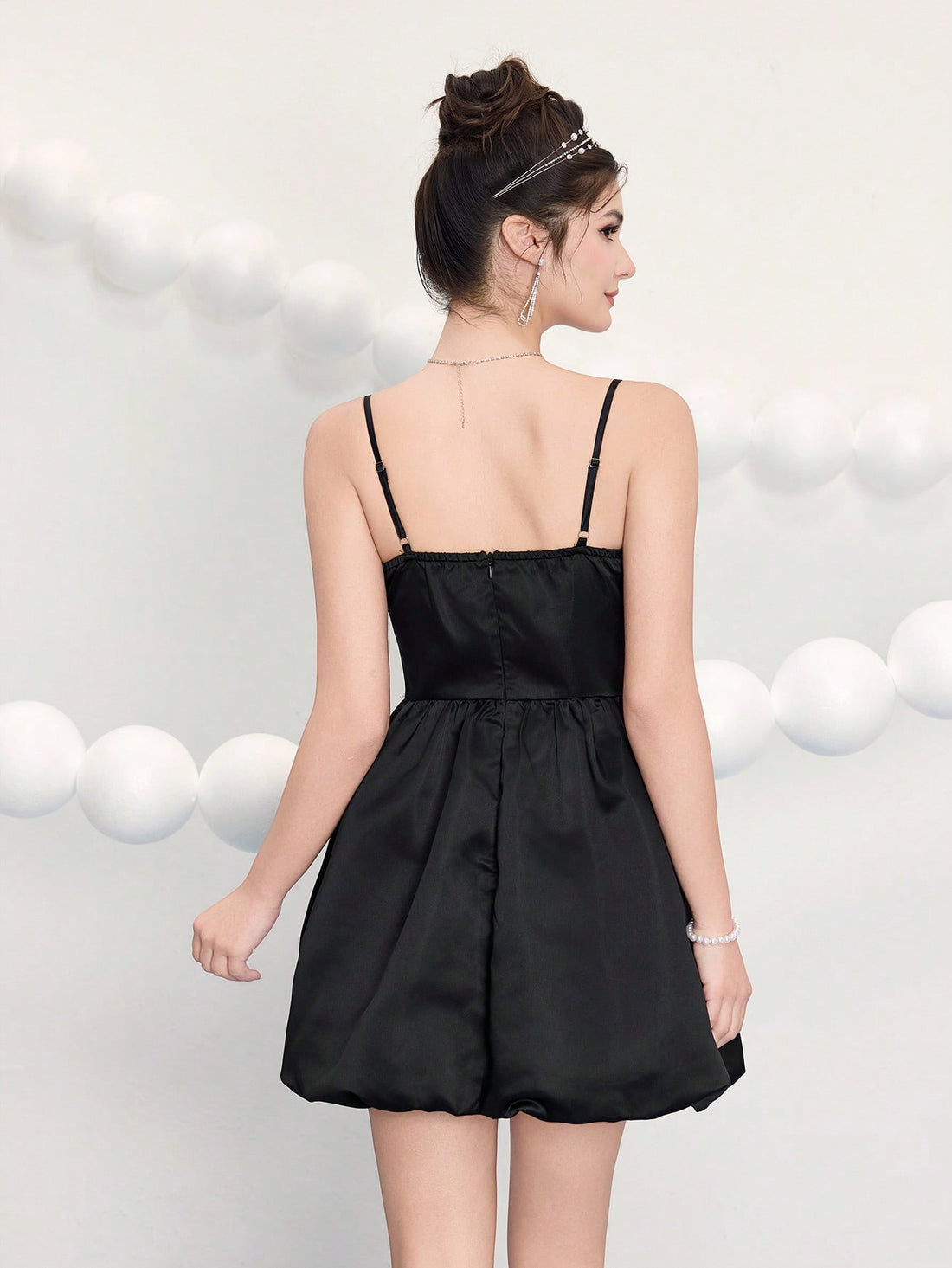 Slip into sophistication with this stunning woven dress that effortlessly blends elegance with a flirty edge. Delicate contrast lace details frame the silhouette while spaghetti straps keep things breezy and chic. Whether you're dancing at a wedding or turning heads at your next celebration, this dress delivers that perfect "wow" moment. The woven fabric drapes beautifully, creating a flattering fit that feels as good as it looks. Your go-to pick for making an unforgettable entrance.