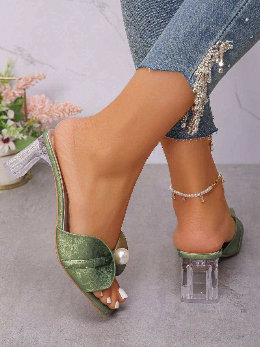 Step into summer with these breathable high heel sandals designed to keep your feet cool and stylish. Featuring a chunky heel adorned with sparkling crystals, they add a playful sparkle to any outfit. Perfect for sunny days and lively nights, these sandals combine comfort and flair for a look that’s both fun and fabulous.