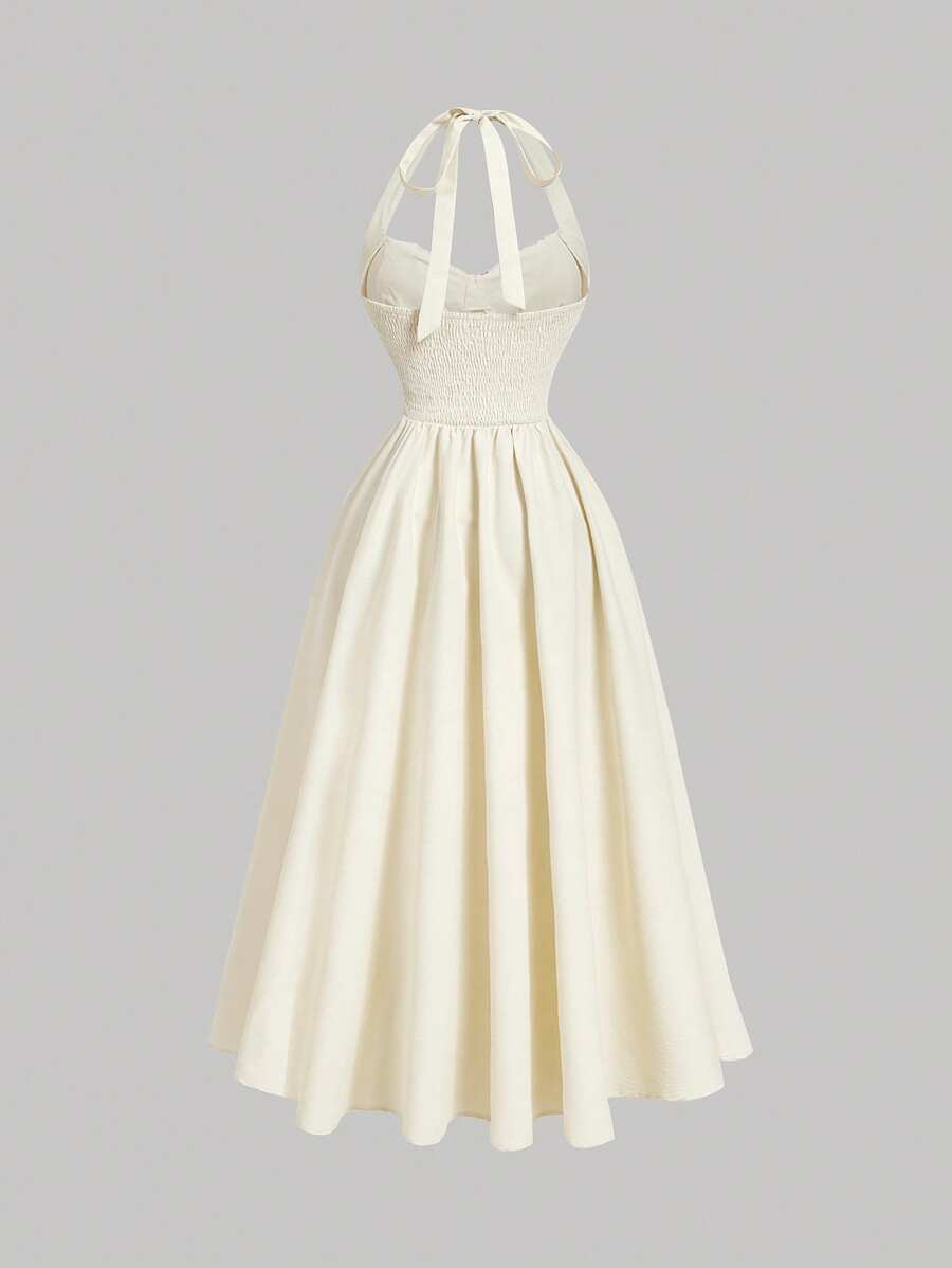 Elevate your occasion wear with this sophisticated light pink halter dress, designed to turn heads at any celebration. The flattering ruched detailing creates a streamlined silhouette while the swing cut offers graceful movement and comfort. A charming bow accent adds feminine elegance, making this piece ideal for parties, New Year's Eve galas, and milestone events. The halter neckline provides secure support and a polished finish. Versatile enough to pair with heels and statement jewelry or keep understate