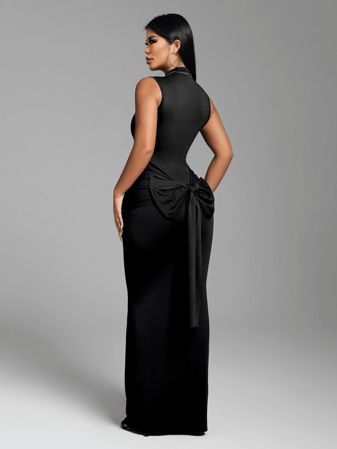Turn heads with this chic backless slip dress that's equal parts sultry and sophisticated. The fitted silhouette hugs your curves in all the right ways, while the tie-up back detail adds an unexpected flirty touch. Crafted in a timeless solid color, it's the perfect canvas for bold accessories and confident vibes. Whether you're heading to a night out or a special occasion, this dress delivers effortless elegance with a playful edge. Slip it on and let your style do the talking.