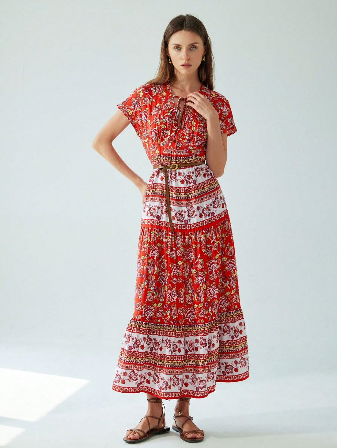 Step into summer with this playful Easy-Wear Print Maxi, featuring a flirty V-neck and a chic halter neck patchwork design. Perfect for breezy days and resort getaways, it combines comfort and style effortlessly. Whether you're strolling the beach or enjoying a sunset cocktail, this maxi dress keeps you cool and radiant all day long.