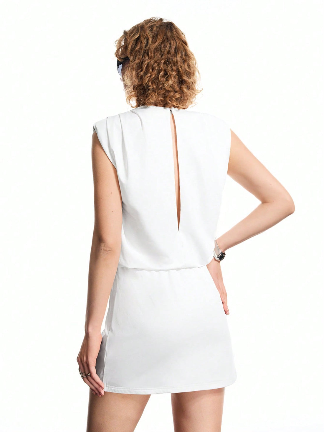 Step out in style with this Elegant White Round Neck Pleated Mini Dress, designed to keep your look fresh and fun. Its airy pleats add a playful bounce to every move, while the classic round neck keeps it effortlessly chic. Perfect for casual days or your daily commute, this dress blends comfort and charm for a wardrobe winner you’ll love to wear again and again.