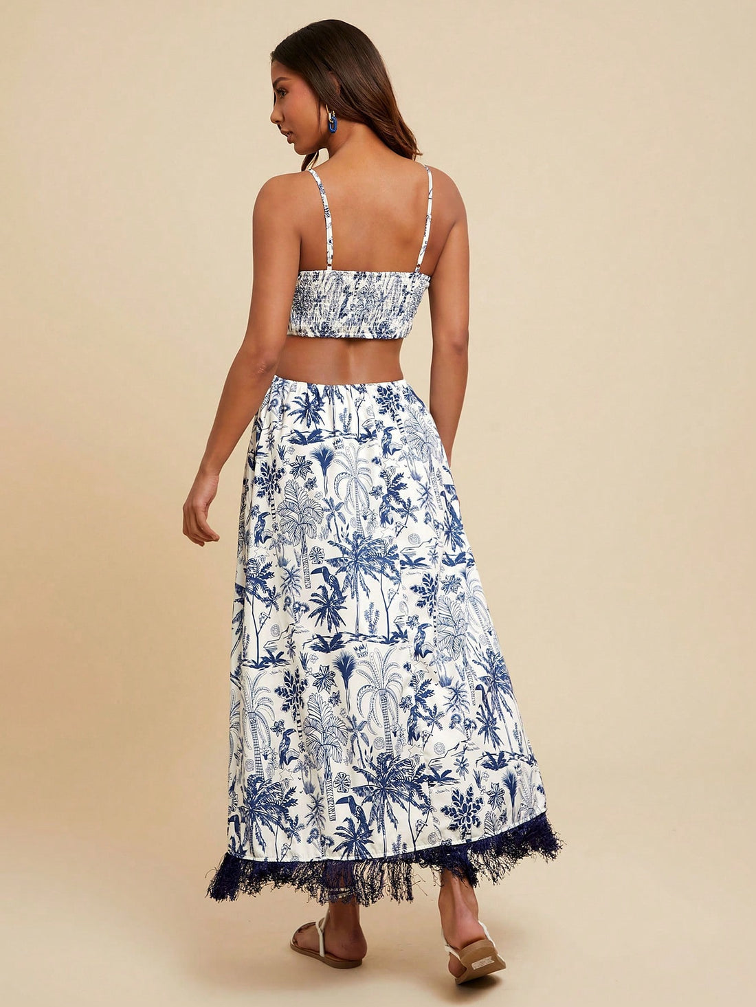 Bring sunshine wherever you go with this Tropical Floral Tasseled Spaghetti Strap Dress. Lightweight and breezy, its playful tassels and vibrant floral print make it a must-have for your summer getaway. Effortlessly stylish, it keeps you cool while turning heads on beach days or evening strolls. Ready to dance in the warm breeze? This dress is your perfect vacation companion.