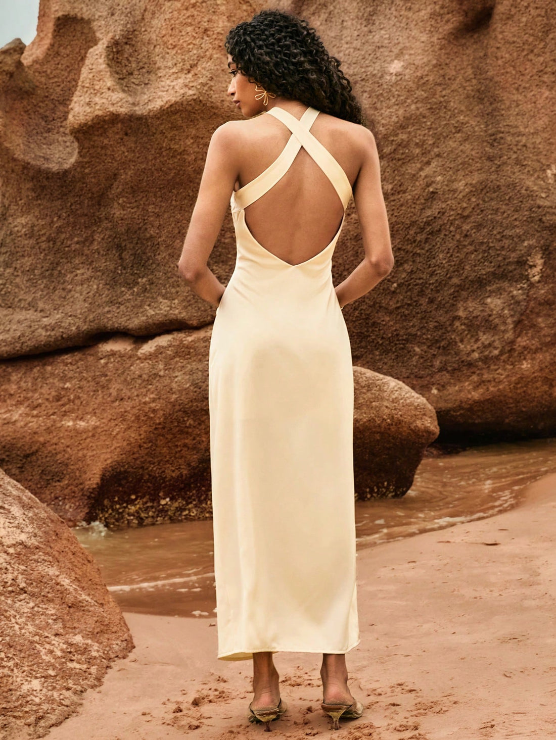 Channel your inner beach goddess with our Elegant Sleeveless V-Neck Summer Dress. The starfish accent adds a fun, coastal touch to this sophisticated design. Stay cool and stylish all summer long with this must-have piece.