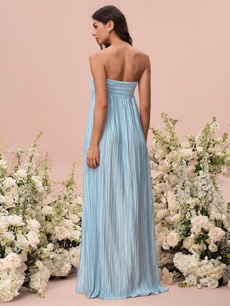 Slip into effortless elegance with this stunning maxi halter dress that's ready to turn heads at any celebration. The flowing silhouette drapes beautifully while the halter neckline offers a flattering, sophisticated touch. Whether you're walking down the aisle as a bridesmaid or dancing under the stars at a summer wedding, this versatile piece transitions seamlessly from ceremony to celebration. The lightweight fabric keeps you cool and comfortable all day long, while the timeless design ensures you'll rea