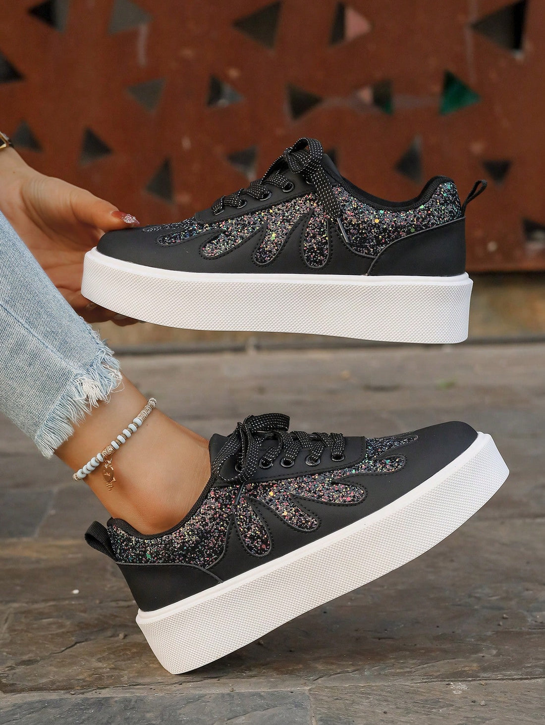 Step into style with our Women's Glitter Lace-Up Sneakers! These dazzling kicks combine eye-catching sparkle with cloud-like comfort thanks to their thick, cushioned soles. Perfect for adding a touch of glamour to your everyday outfits, these playful sneakers will have you dancing through your day while turning heads. Who says comfort can't be fabulous?