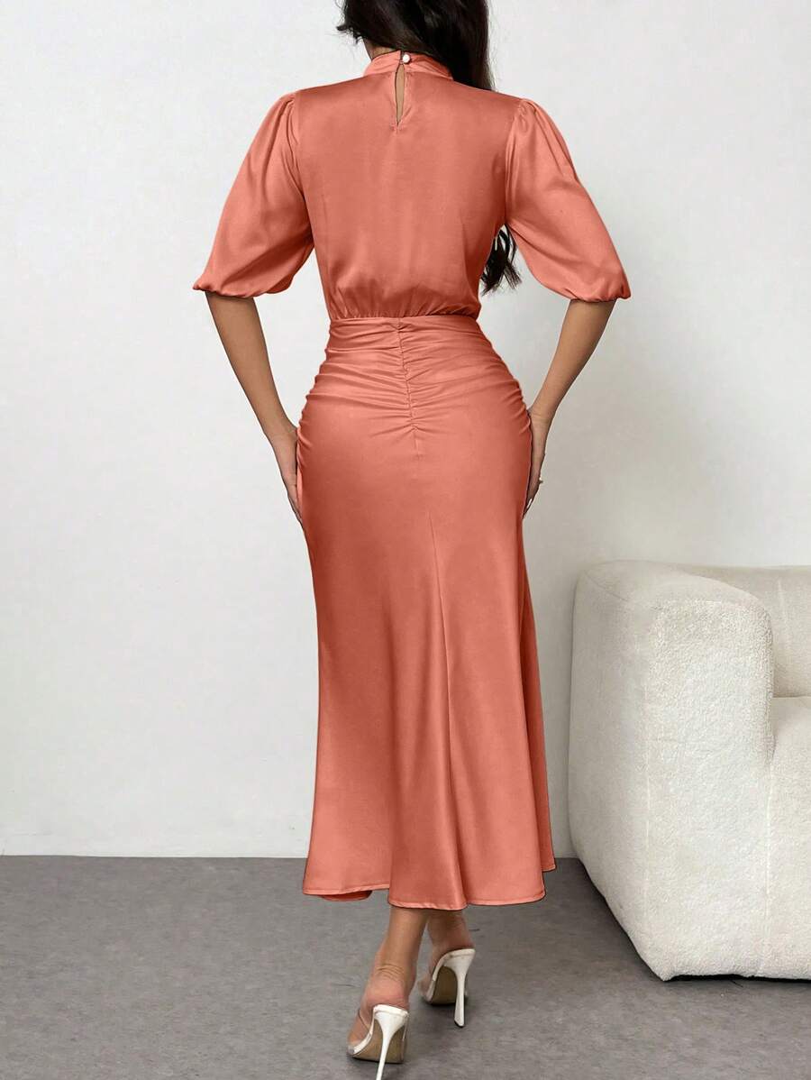 Unleash your inner mermaid in this elegant puff sleeve maxi dress. Made from luxurious satin, this dress cinches at the waist for a flattering silhouette. Perfect for any occasion, it's the ultimate statement piece for the fashion-forward woman. (Just try to resist twirling in it - we dare you!)