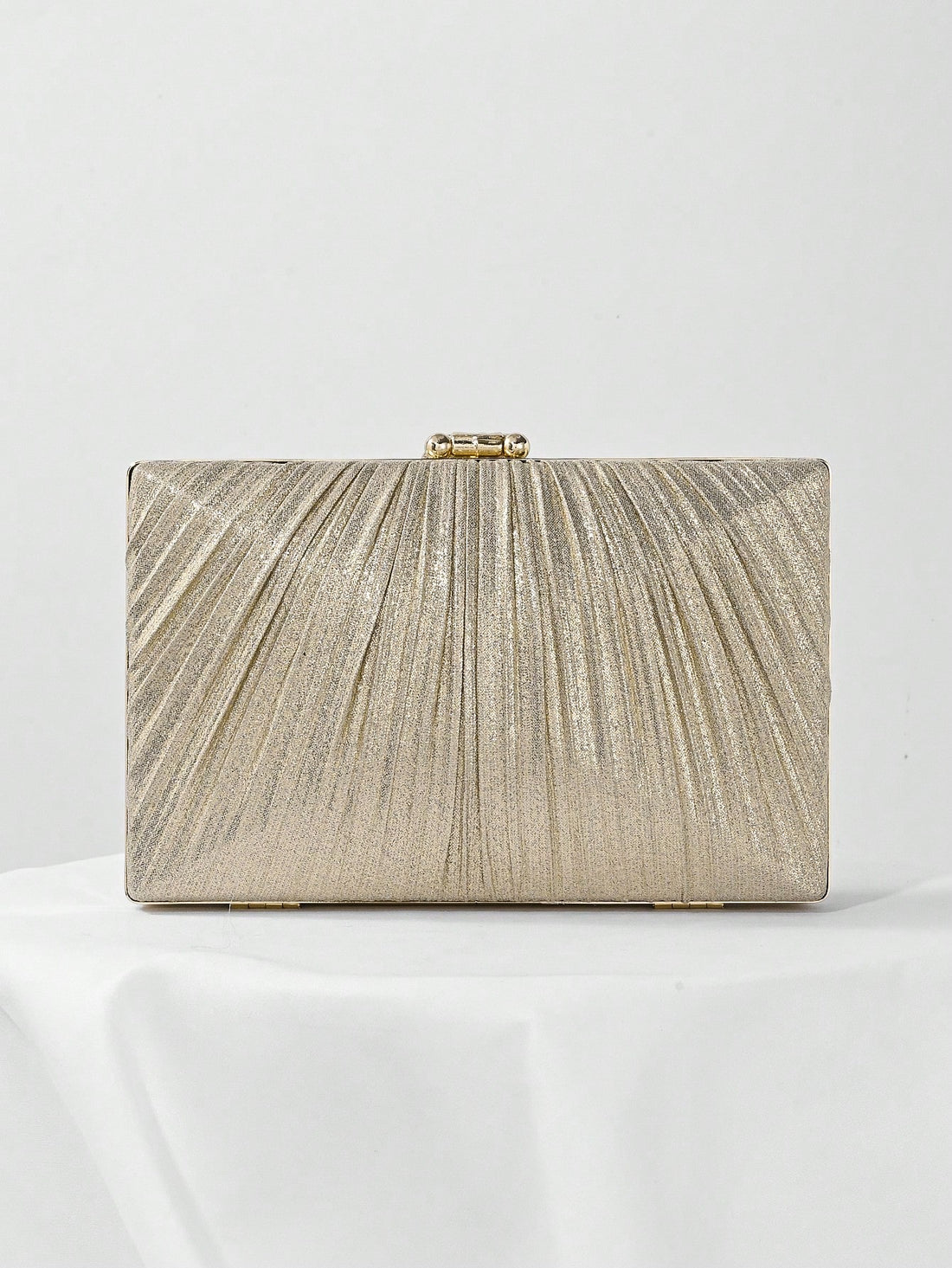 Add a touch of sparkle to your special occasions with this Luxurious Metallic Leaf Clutch Bag. Its shimmering leaf design catches the light beautifully, making it the perfect playful accessory for weddings, parties, and proms. Compact yet roomy enough for your essentials, this elegant handbag lets you dance the night away in style.