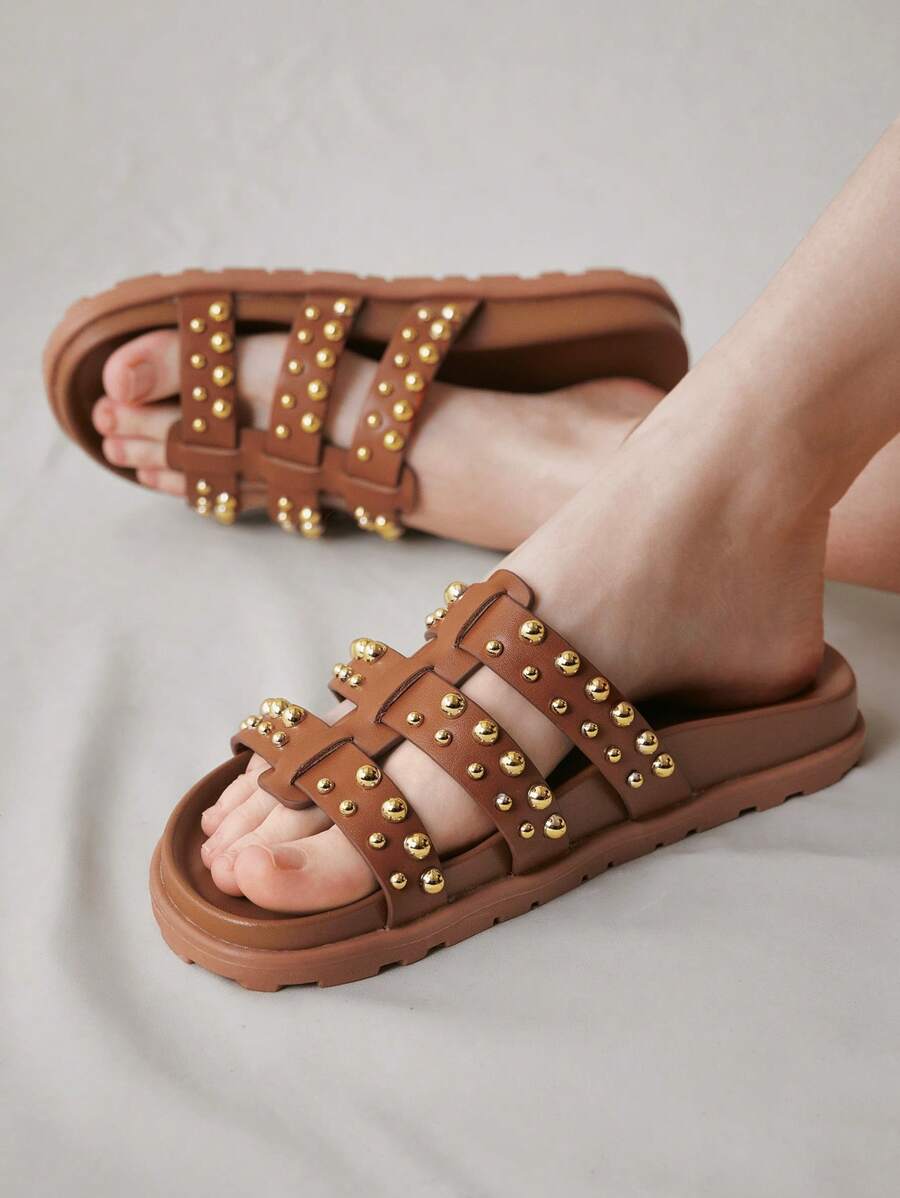 Step into summer with these chic flat sandals designed to keep you stylish and comfortable all day long. Their versatile design pairs effortlessly with any outfit, making them your go-to choice for beach days, brunches, or casual strolls. Lightweight and breathable, they let your feet breathe while adding a playful touch to your look. Perfect for every sunny occasion, these sandals bring fun and flair to your warm-weather wardrobe.