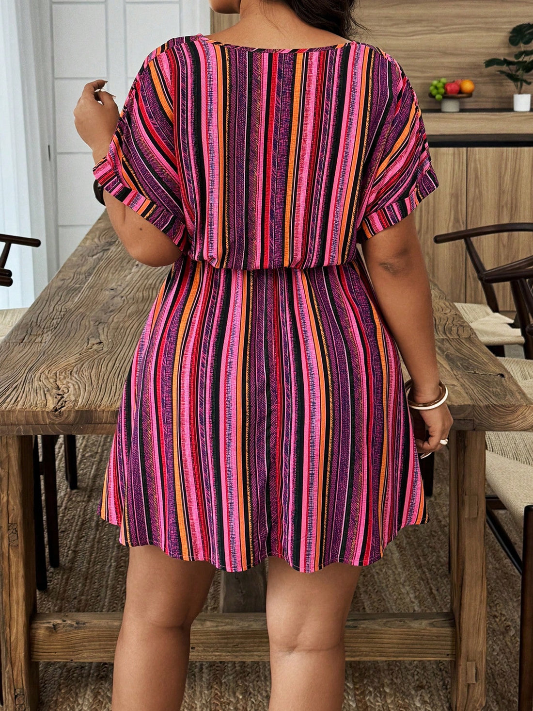 Step into summer with this playful plus size striped dress, designed to keep you cool and stylish. Featuring a flattering V-neck and breezy short sleeves, it’s perfect for casual outings or sunny days. The vibrant stripes add a fun twist to your wardrobe, making every moment feel like a sunny adventure. Comfortable, chic, and effortlessly trendy—this dress is your new go-to for easy summer style.