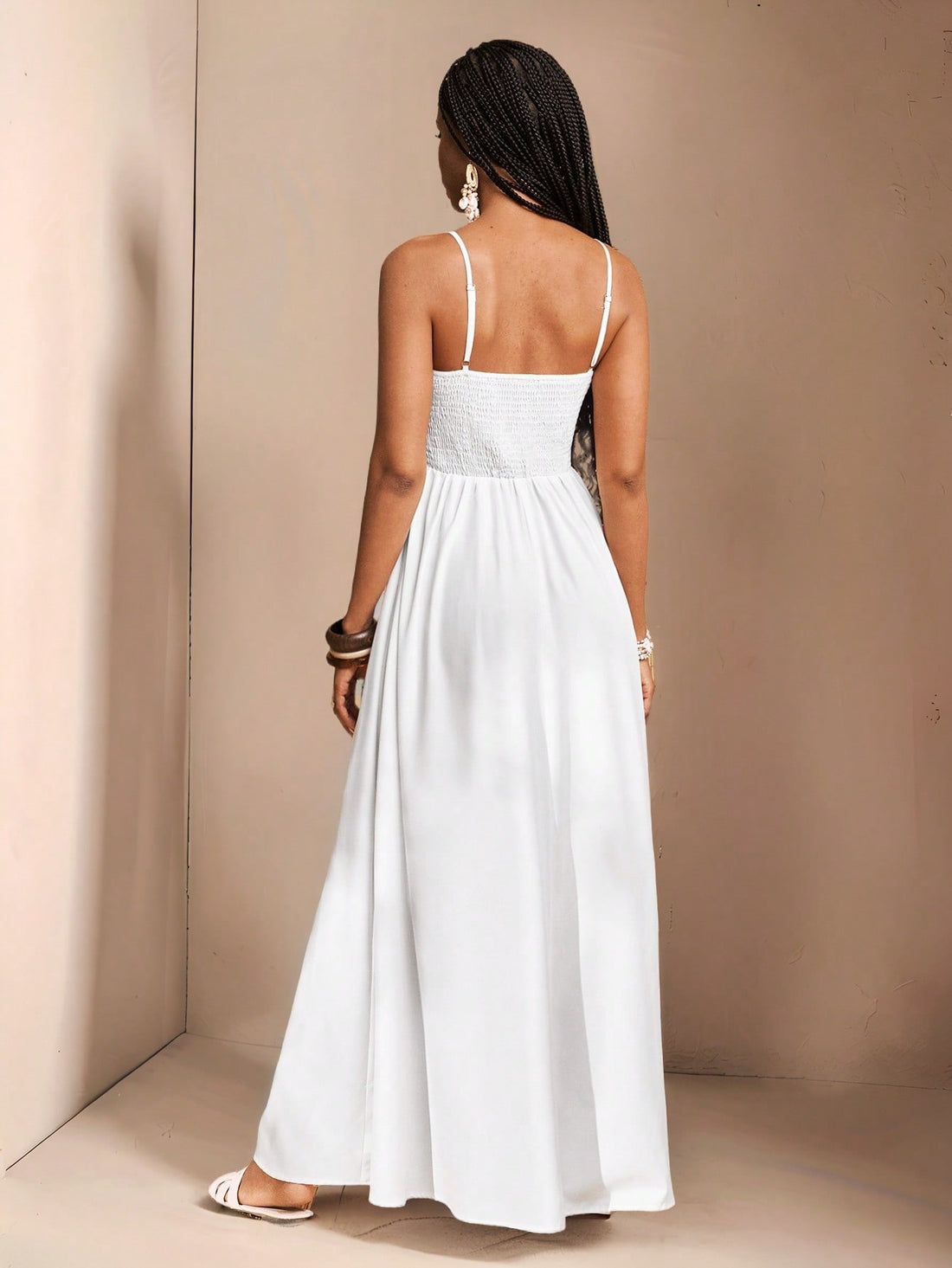 Get ready to slay this wedding season with our Elegant White Spaghetti Strap Dress! This stunning dress is perfect for spring and summer weddings, designed by Slaydiva for women who want to look stylish and chic. The long, flowy silhouette and delicate spaghetti straps will have you feeling like a true diva.