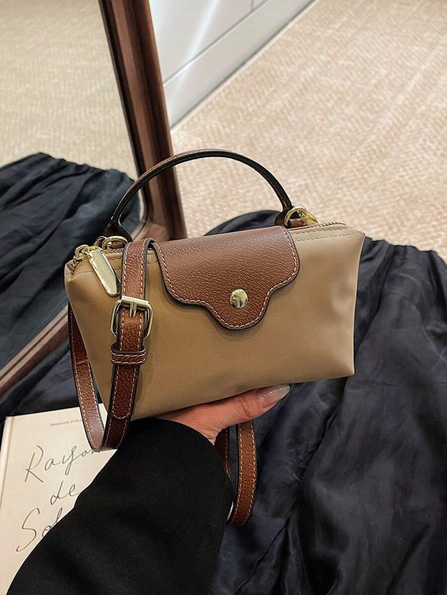 Elevate your everyday look with this Trendy Women's Minimalist Dumpling Bag. Crafted from lightweight nylon, it’s ready to keep up with your busy office days and college adventures. Its sleek dumpling shape adds a fun twist to minimalist style, while spacious compartments keep your essentials organized. Whether you’re rushing to class or heading into meetings, this versatile handbag is your new go-to for effortless, playful chic.