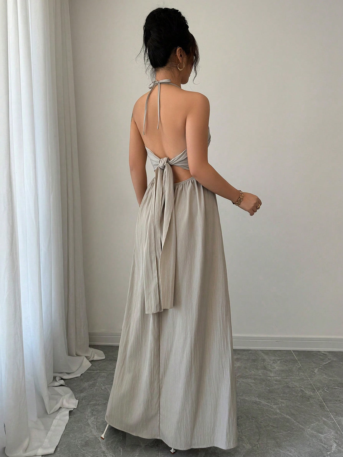 Effortlessly exude elegance with our Halter Lace-Up Backless A-Line Dress. This dress features a stylish halter neckline and a lace-up back, adding a touch of sophistication to your look. The A-line silhouette provides effortless style, making this dress a must-have for any fashion-forward wardrobe.