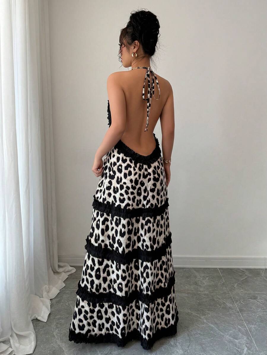 Turn heads at the beach with this stunning backless dress featuring a bold black leopard print that's equal parts wild and sophisticated. The delicate lace trim adds a touch of elegance, while the daring open back design keeps things flirty and fun. Perfect for making a statement by the water or transitioning from sand to sunset cocktails. This piece proves you don't need much fabric to make a major fashion impact.