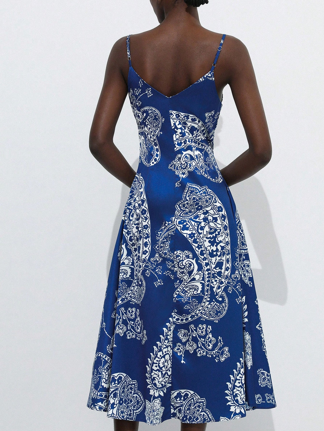 Step into sunshine with this playful blue and white summer dress, featuring delicate spaghetti straps and a charming paisley floral print. Perfect for vacation vibes, its breezy design keeps you cool while adding a splash of fun to your wardrobe. Whether strolling the beach or sipping cocktails, this dress brings effortless style and a carefree spirit to every sunny day.